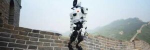 A robot is walking along the Great Wall of China under a hazy sky.