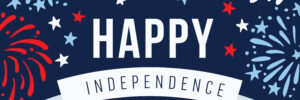 A graphic image with a dark blue background featuring stylized fireworks in blue, white, and red. In the foreground, large white letters read "HAPPY" and below, on a white ribbon banner, the words "INDEPENDENCE day" are written in dark blue. Scattered around the text are small white, blue, and red stars.