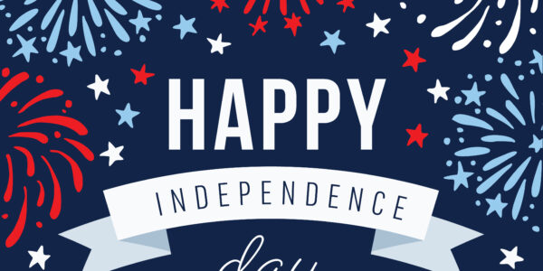 A graphic image with a dark blue background featuring stylized fireworks in blue, white, and red. In the foreground, large white letters read "HAPPY" and below, on a white ribbon banner, the words "INDEPENDENCE day" are written in dark blue. Scattered around the text are small white, blue, and red stars.